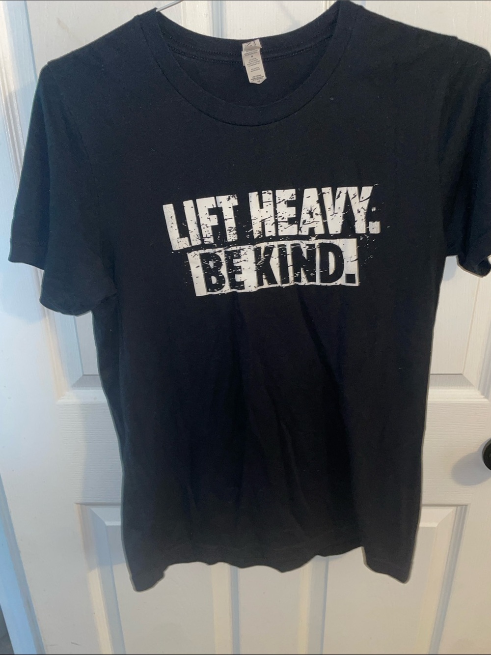 Bella Canvas Black Short Sleeve Tee with White 'Lift Heavy. Be Kind.' Graphic